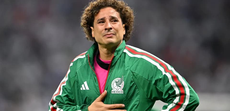 Goalkeeper wearing Mexico jacket on the field
