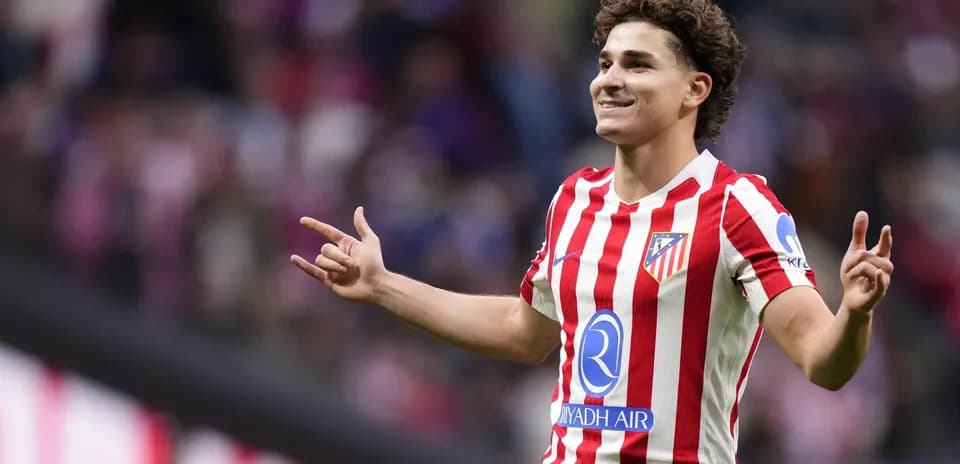 Player celebrating after scoring a goal for Atlético Madrid