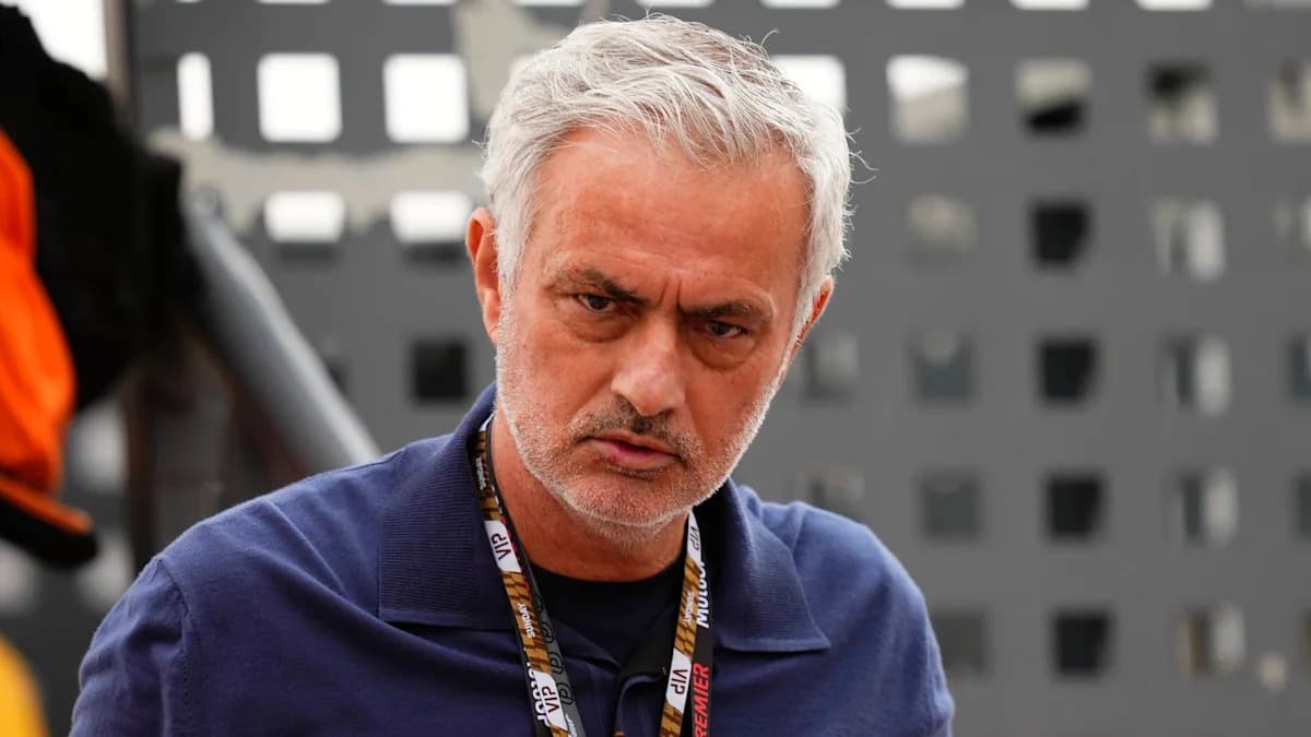 Man with gray hair wearing a blue shirt