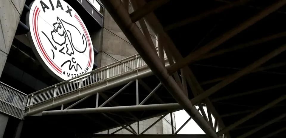Ajax Amsterdam logo displayed on stadium exterior