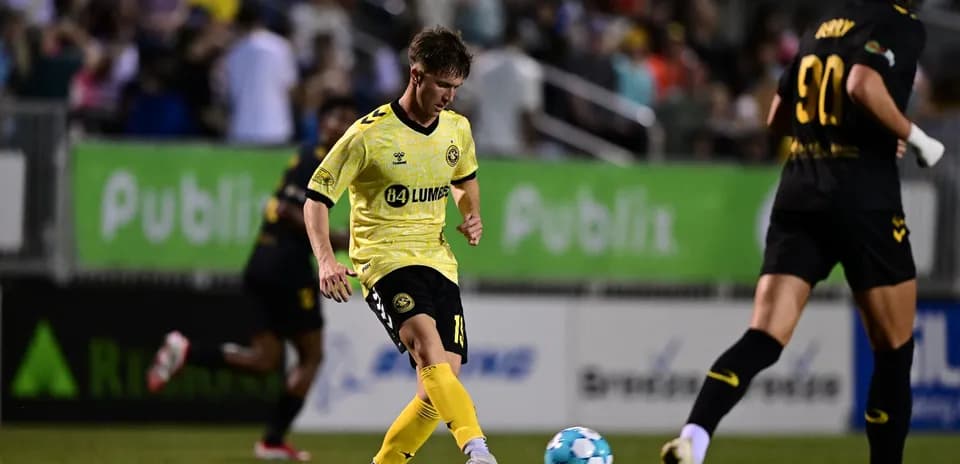 Charleston Battery player passing the ball