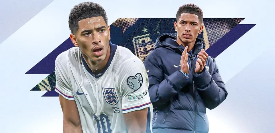 Player in England kit and applauding teammate