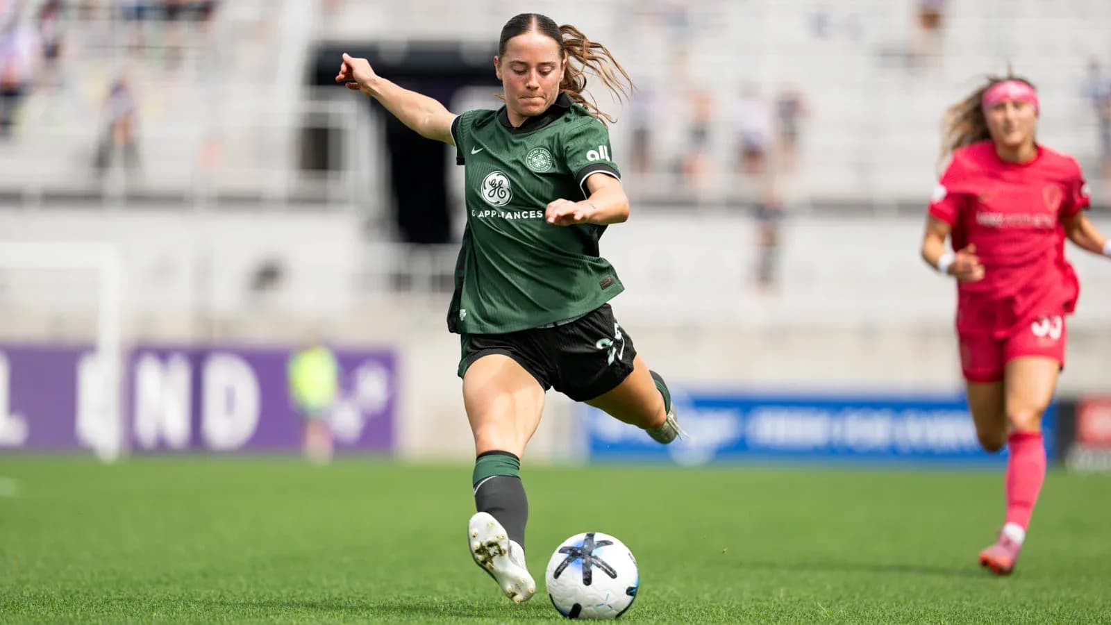 Player kicking ball during NWSL match