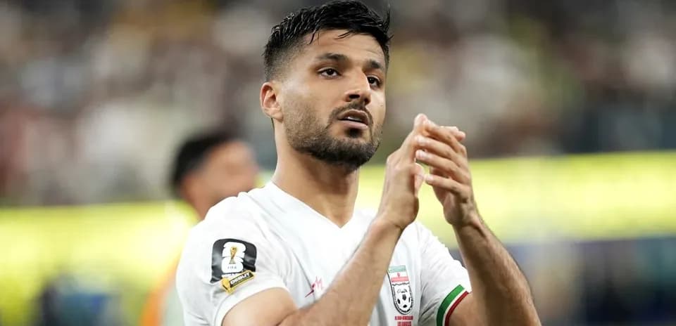 Player applauding fans after a match