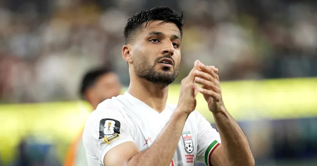 Player applauding fans after a match