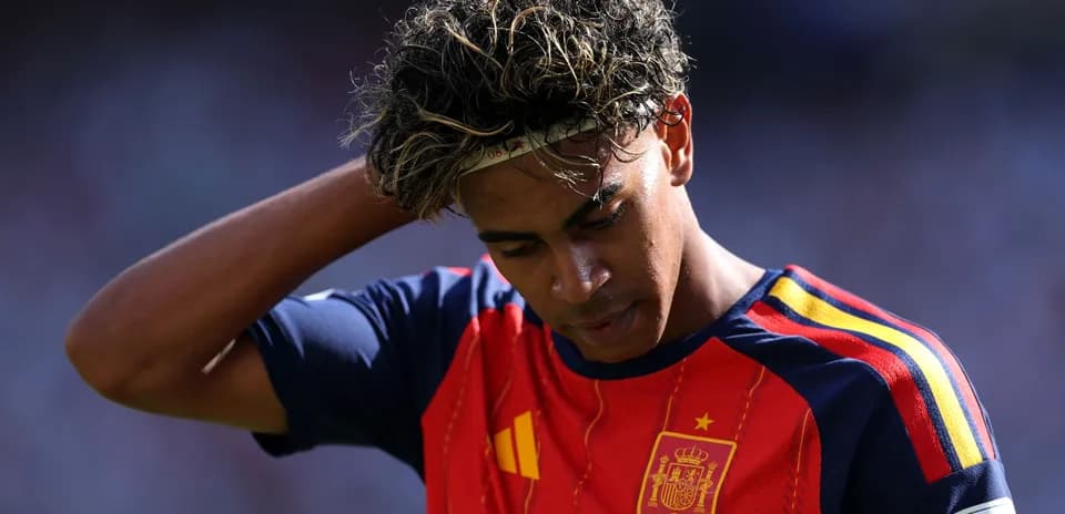Player in Spain jersey looking down during match