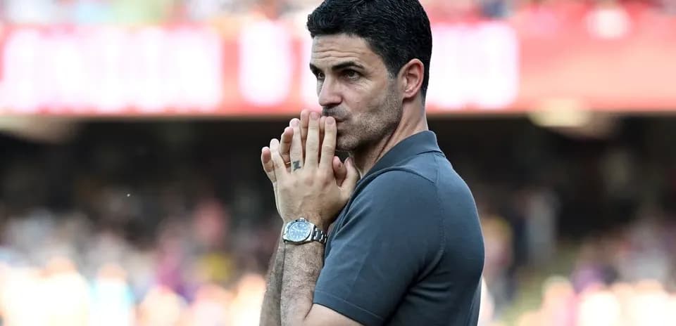 Manager observing the match with focused expression