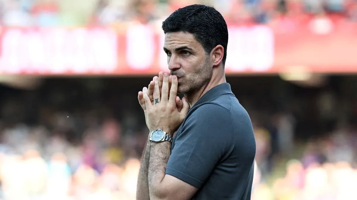 Manager observing the match with focused expression