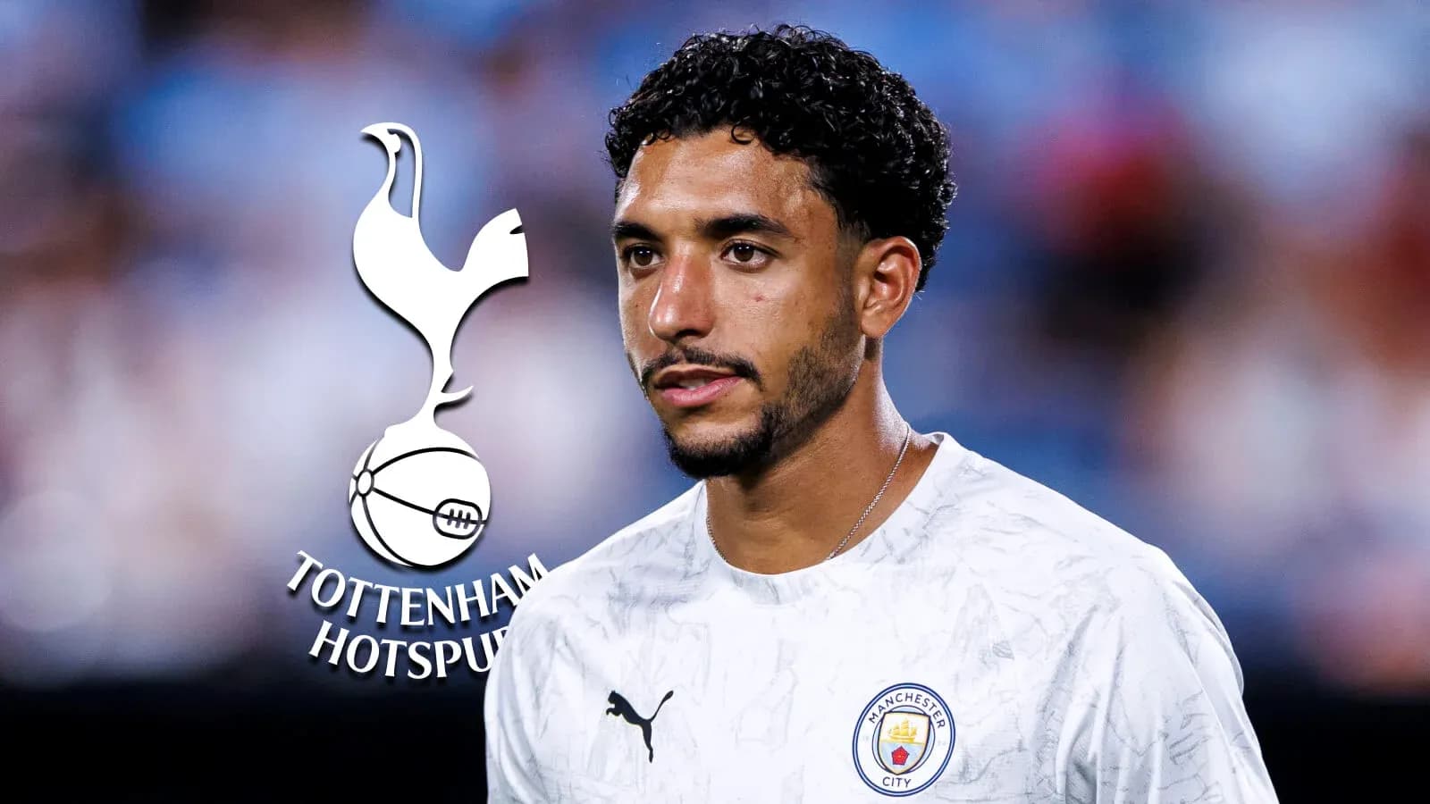 Player in Manchester City kit with logos