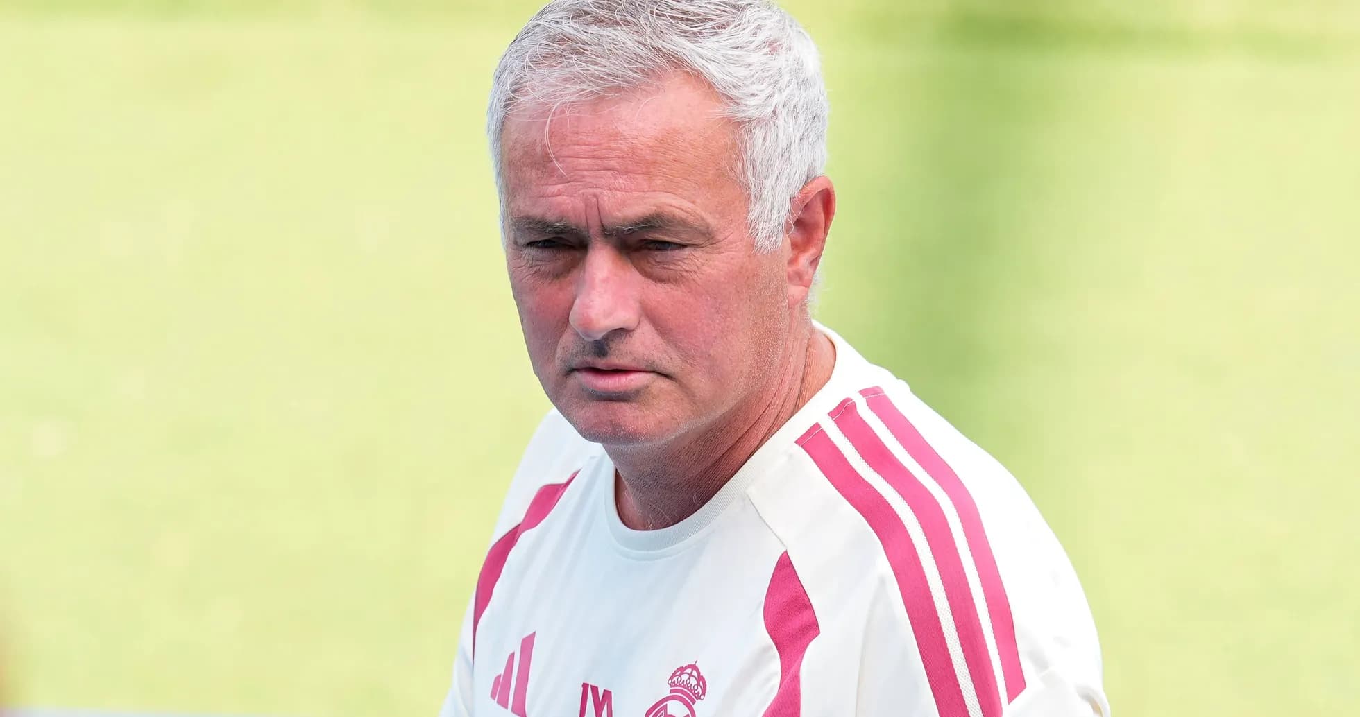 Coach wearing Real Madrid training kit outdoors