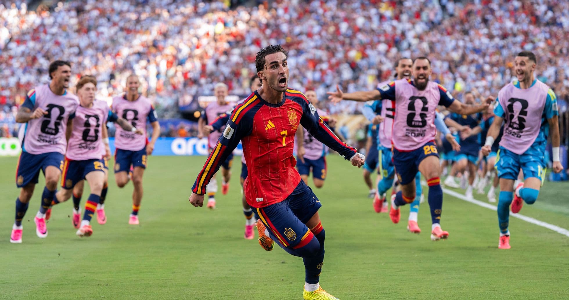 Spain player celebrating a goal with teammates