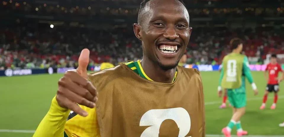 Player celebrating with a thumbs up on the field