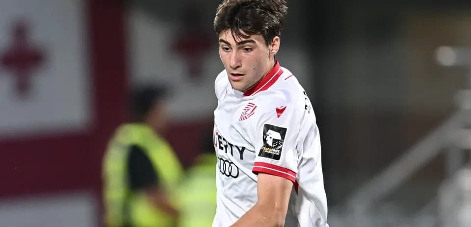 Player in white jersey during soccer match action
