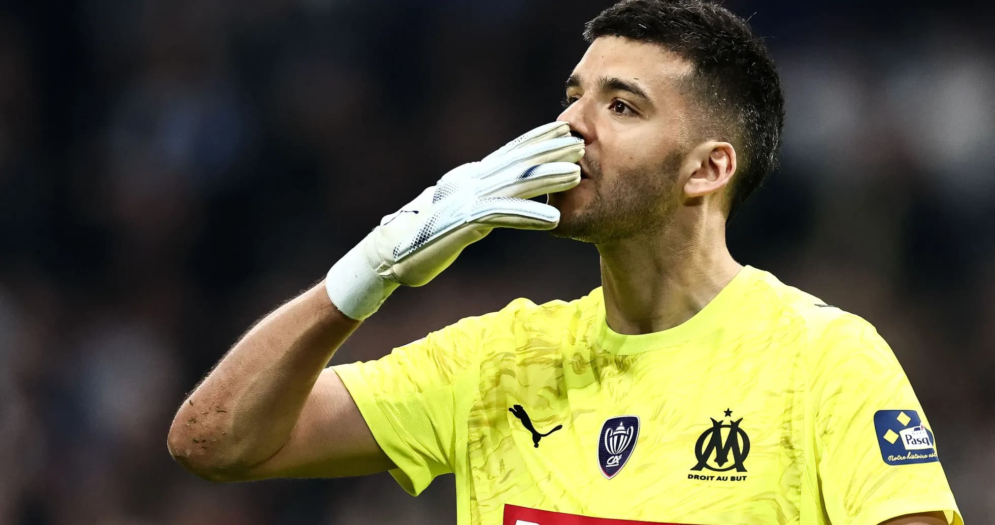 Goalkeeper celebrating with a hand gesture