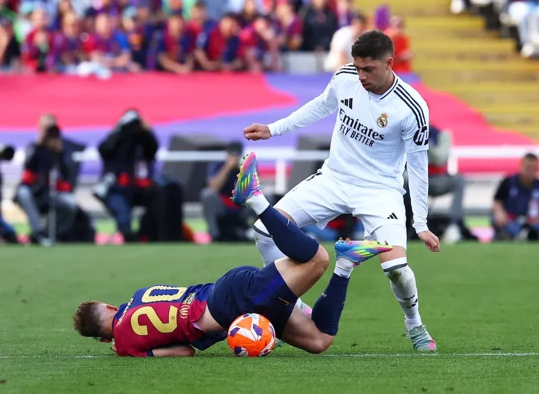 Barcelona player falls during El Clasico match
