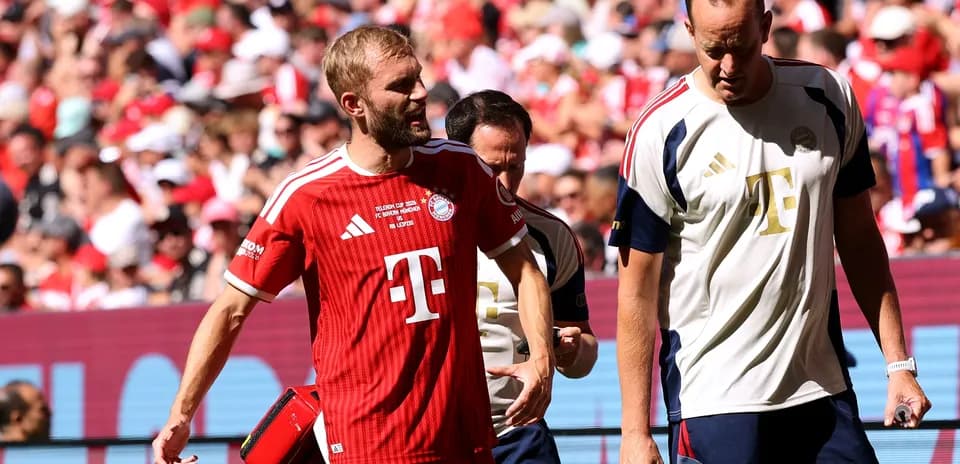 Bayern Munich players walking off the field after match