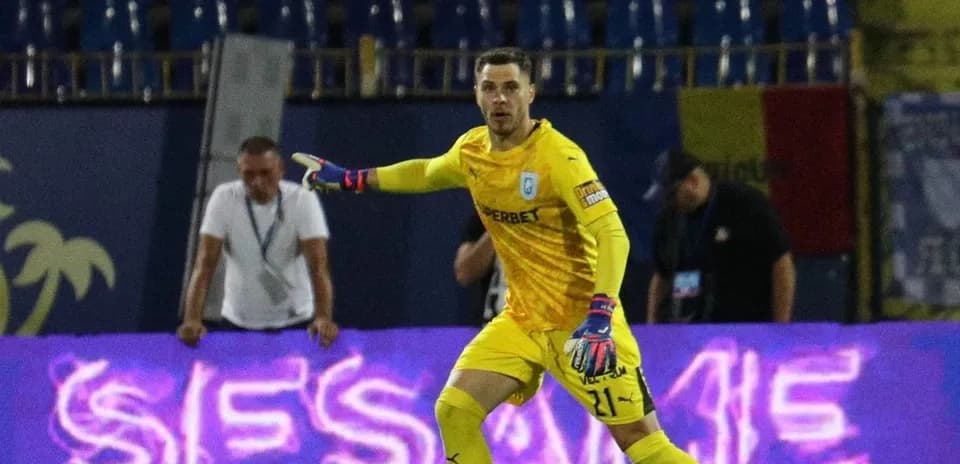 Goalkeeper directing play during UEFA match