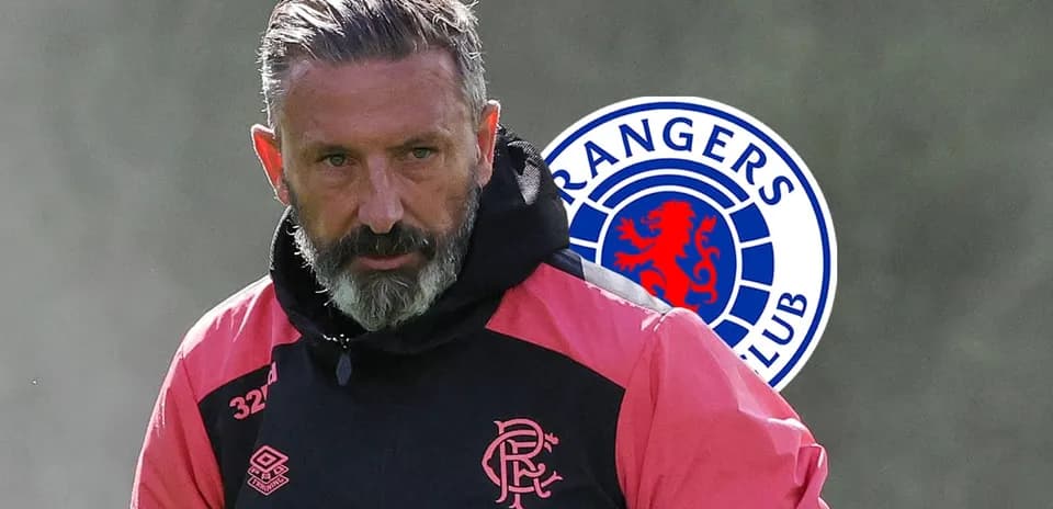 Coach in training gear with Rangers logo background
