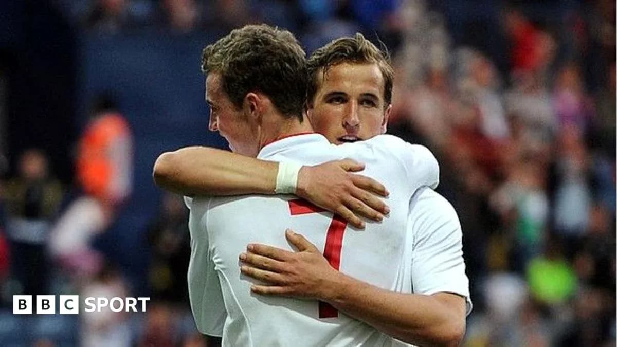 Two players embracing on the football field