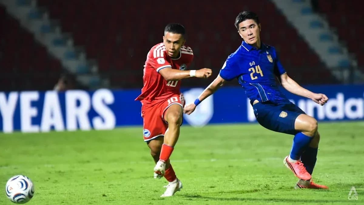 Two players competing for the ball during match