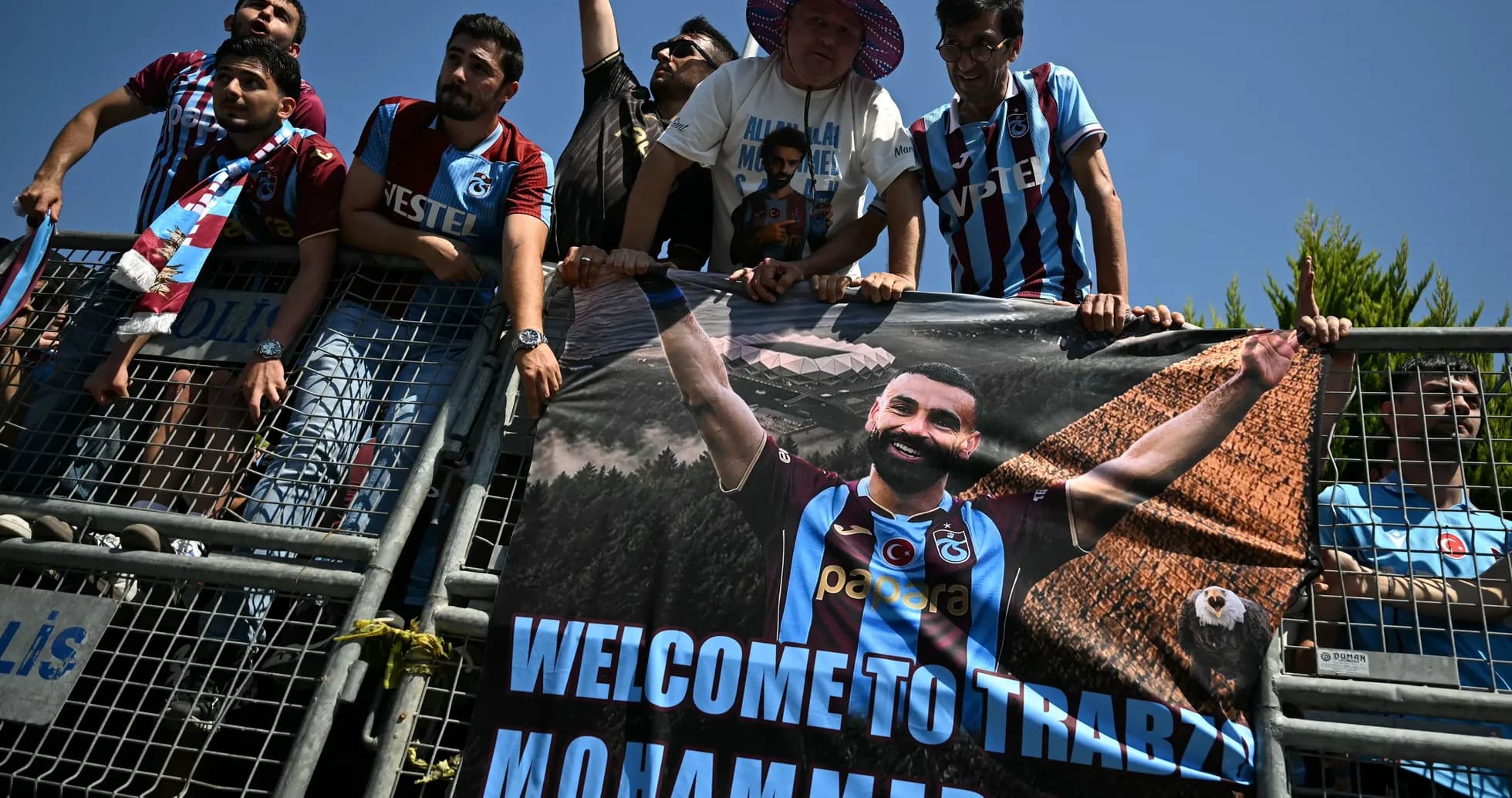 Fans holding a banner welcoming player Mohammed Salah