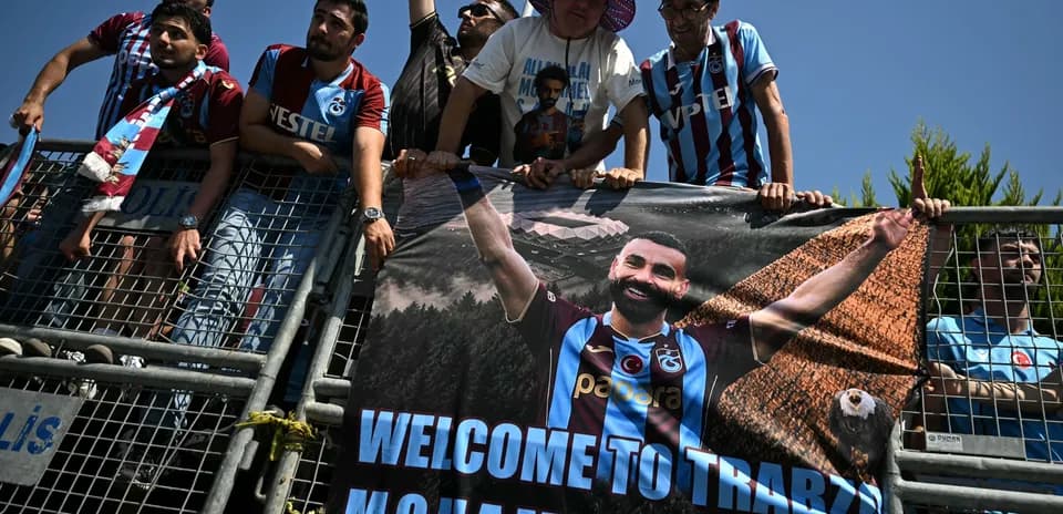 Fans holding a banner welcoming player Mohammed Salah