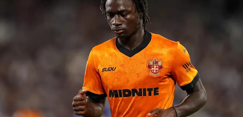 Player wearing orange jersey during match