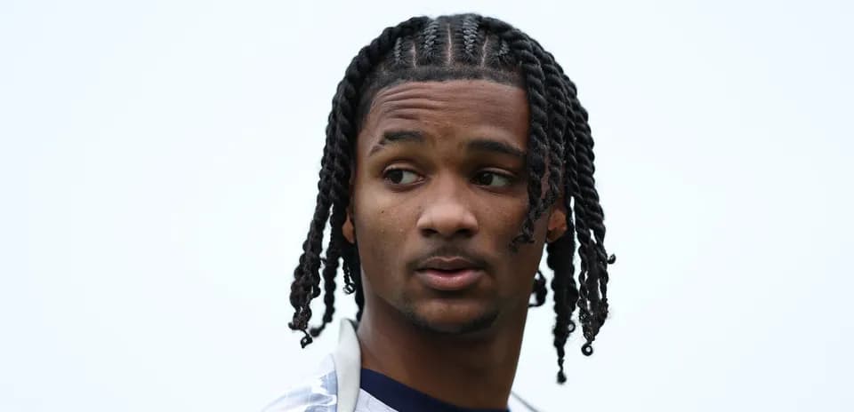 Player with braided hair looking to the side