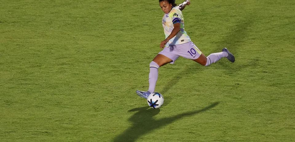 Player kicking the ball during NWSL match