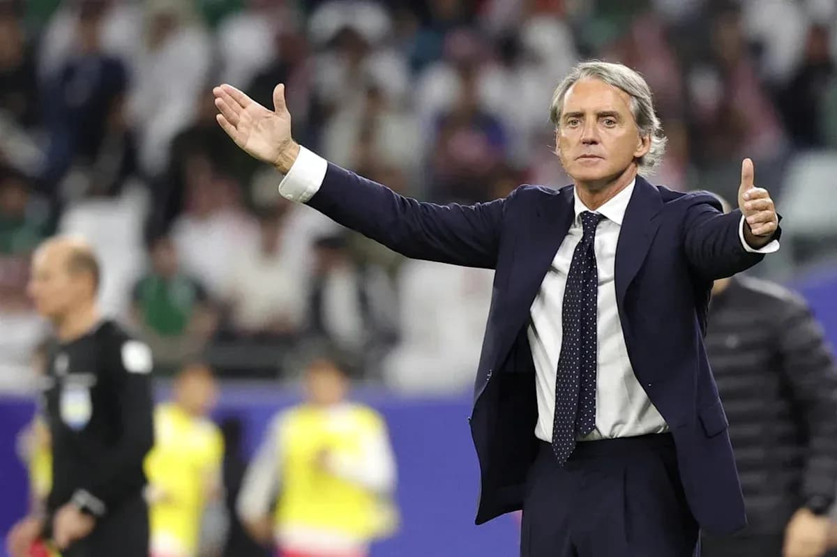 Coach directing players during a football match