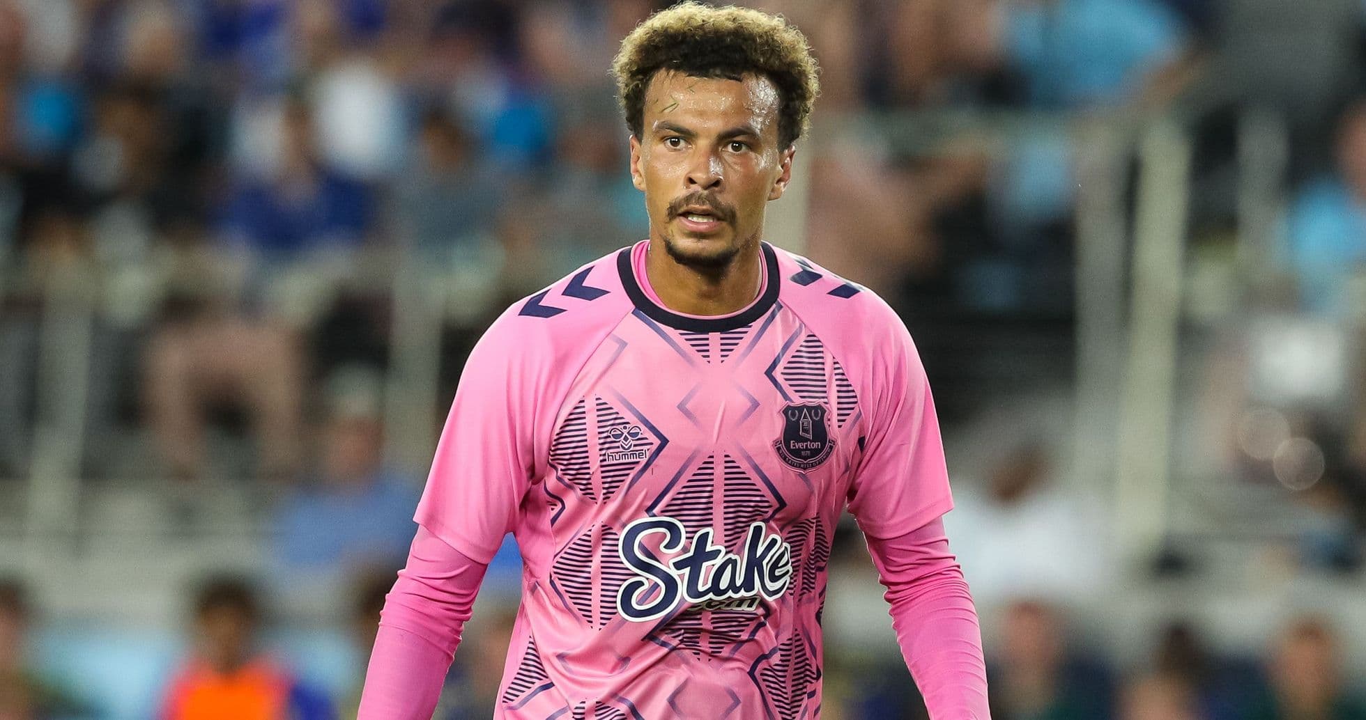 Goalkeeper in pink jersey during match