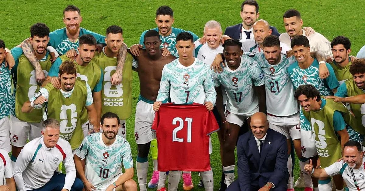 Portugal team celebrating with jersey after match