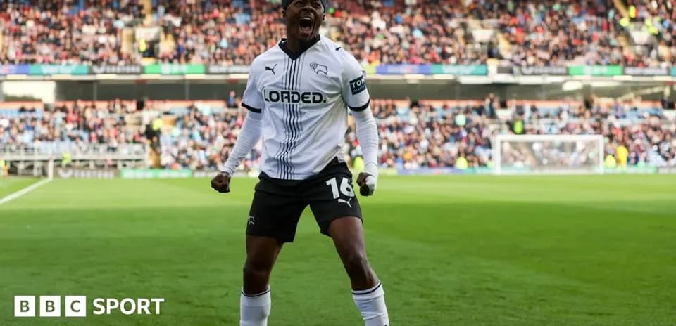 Player celebrating in Derby County jersey on pitch