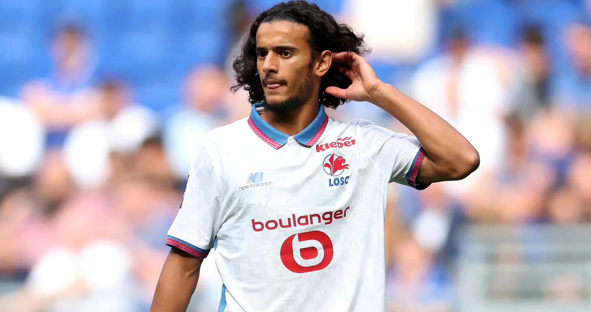 Player in white jersey during football match