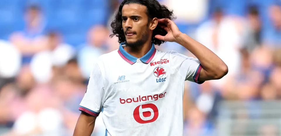 Player in white jersey during football match