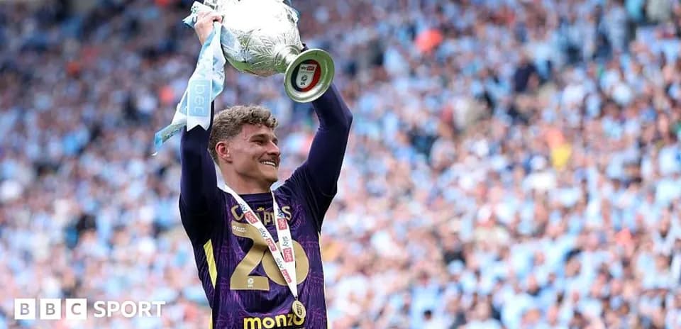 Player celebrating with trophy after match victory