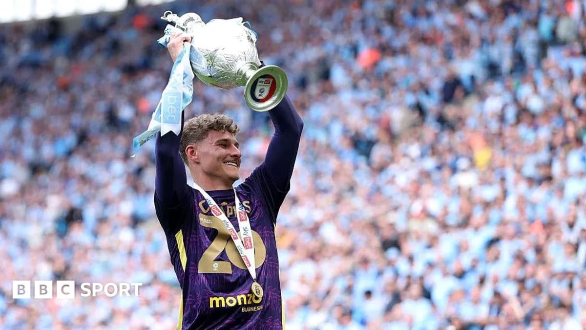 Player celebrating with trophy after match victory
