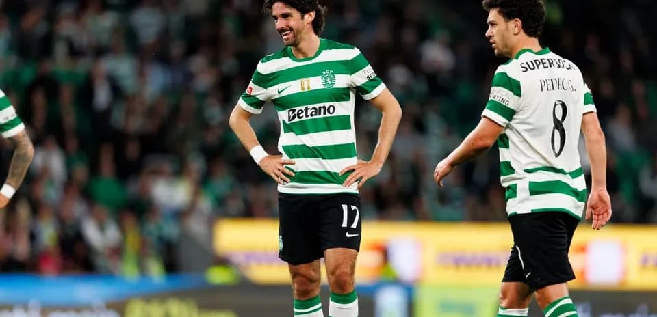 Two Sporting CP players on the field during match