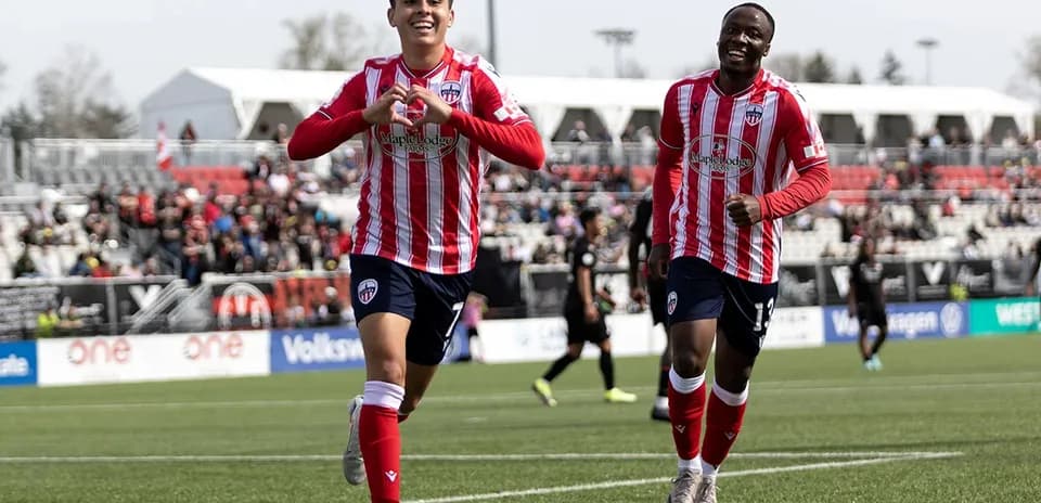 Players celebrating a goal during match