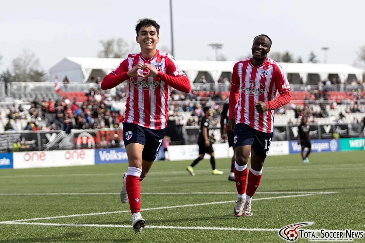 Players celebrating a goal during match