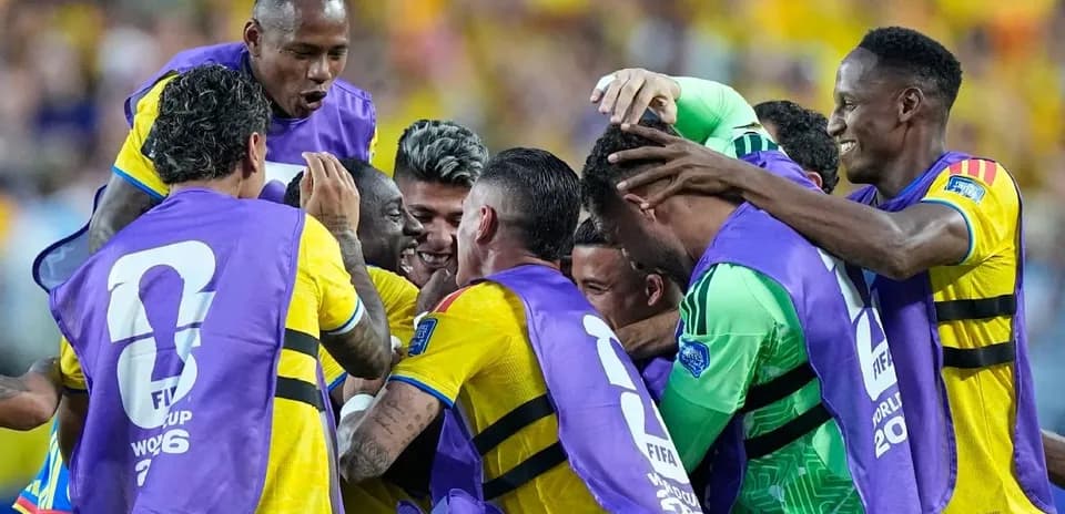 Players celebrating a goal during a match