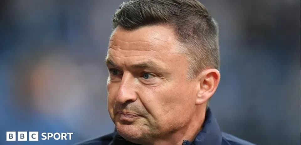 Manager looking thoughtful during a match