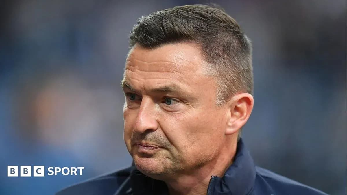 Manager looking thoughtful during a match