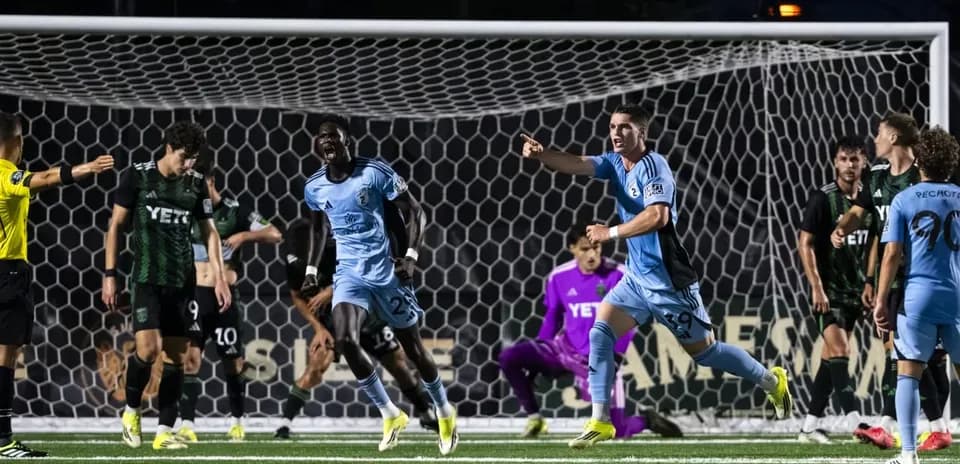 Players celebrating a goal during MLS Next Pro match