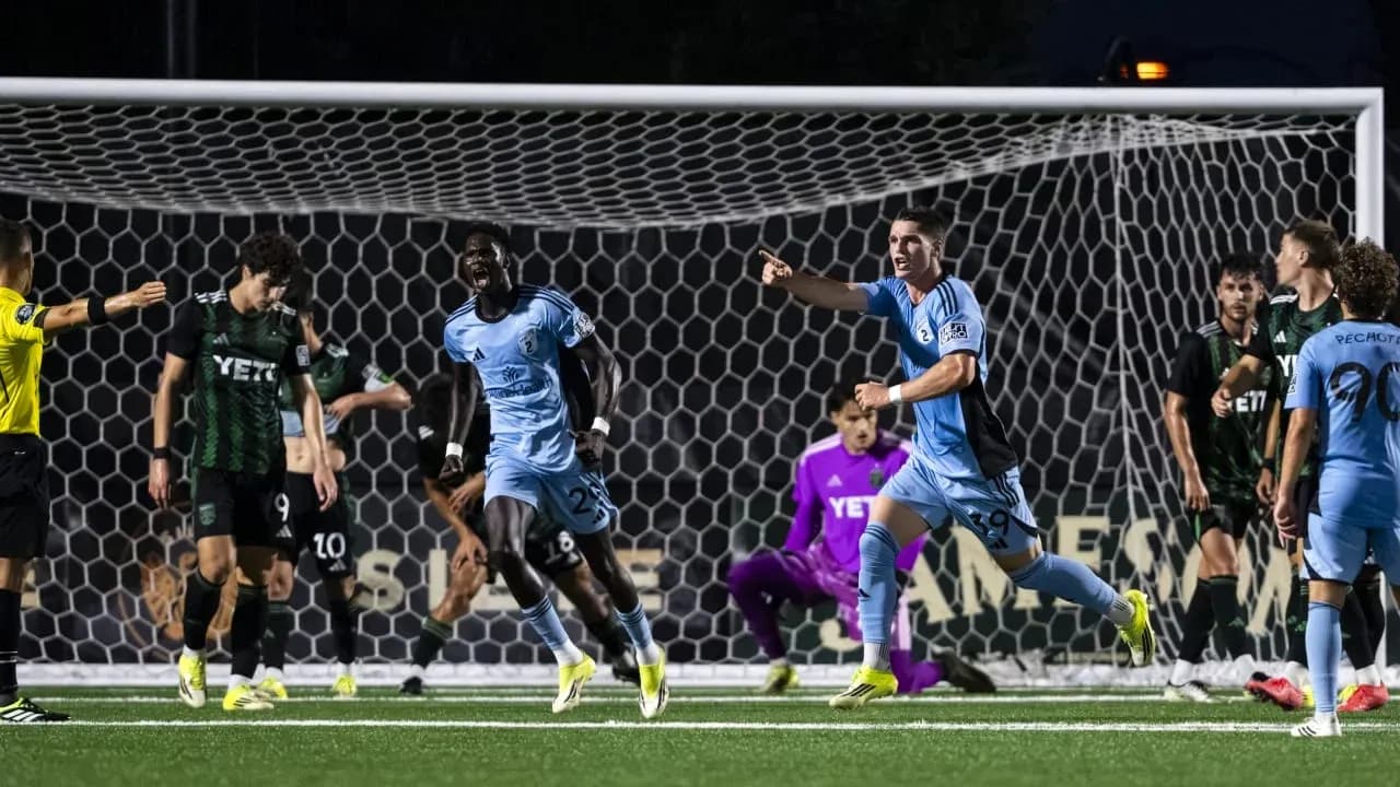 Players celebrating a goal during MLS Next Pro match