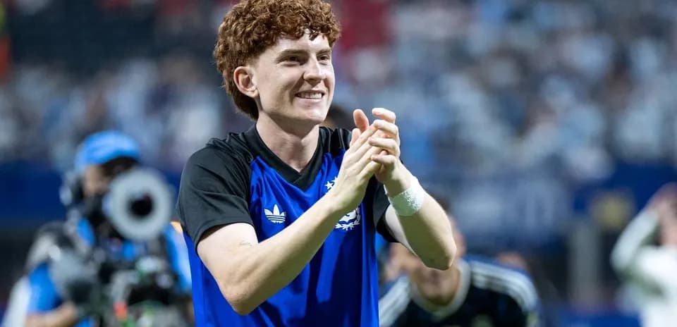 Player applauding fans after a match
