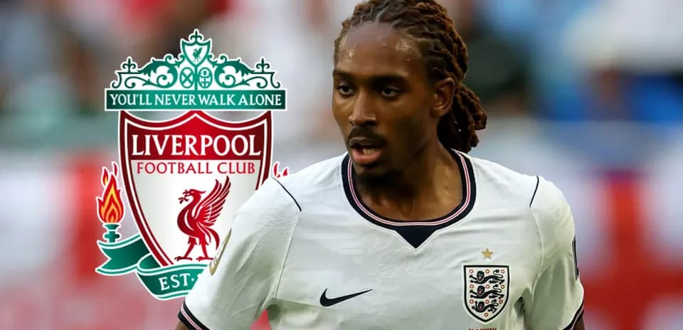 Player running on the field with Liverpool logo