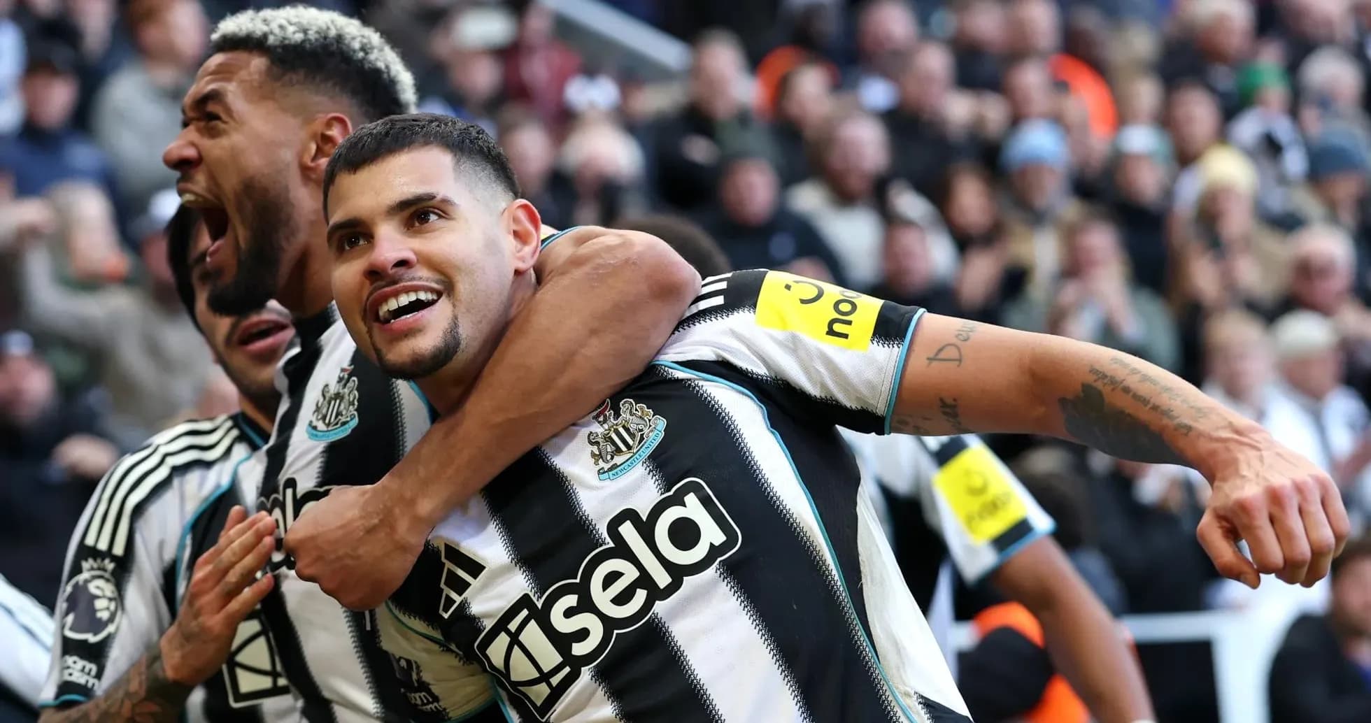 Newcastle players celebrating a goal during match