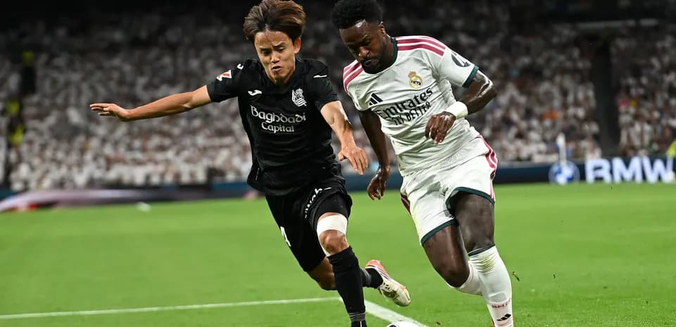 Two players competing for the ball during match