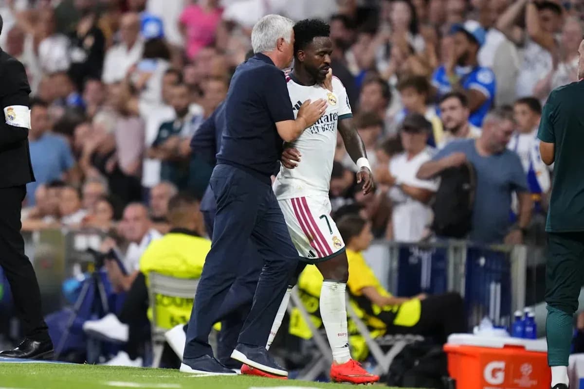 Coach interacting with player during match substitution